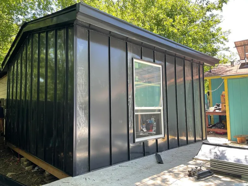 Black standing seam metal wall panels for Roof Inspection in Newport